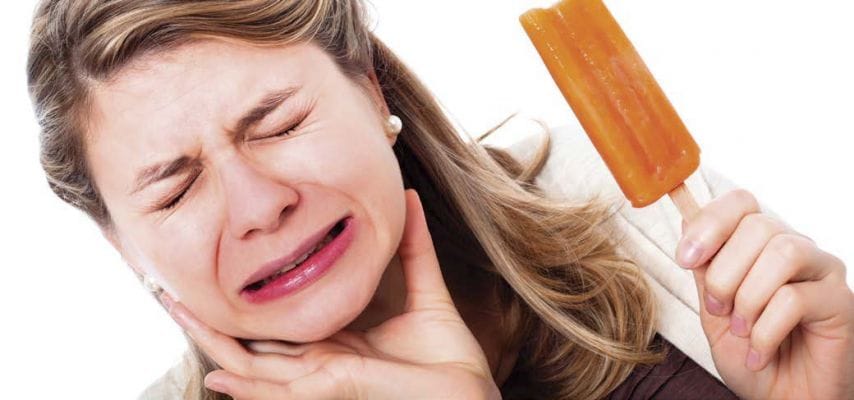 Reabilitação oral Divinópolis — sensibilidade dental ao tomar gelado